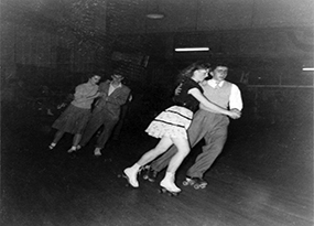 A young couple roller skating circa 1947