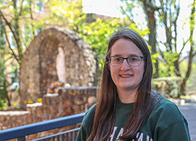 woman on university lawn on a sunny day