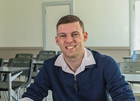 male student sitting in classroom