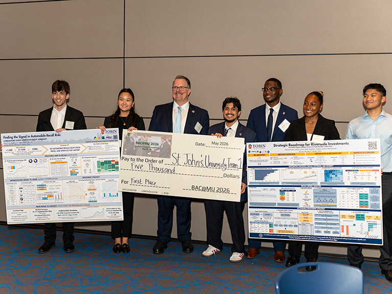 Student presents a poster during the Business Analytics Competition