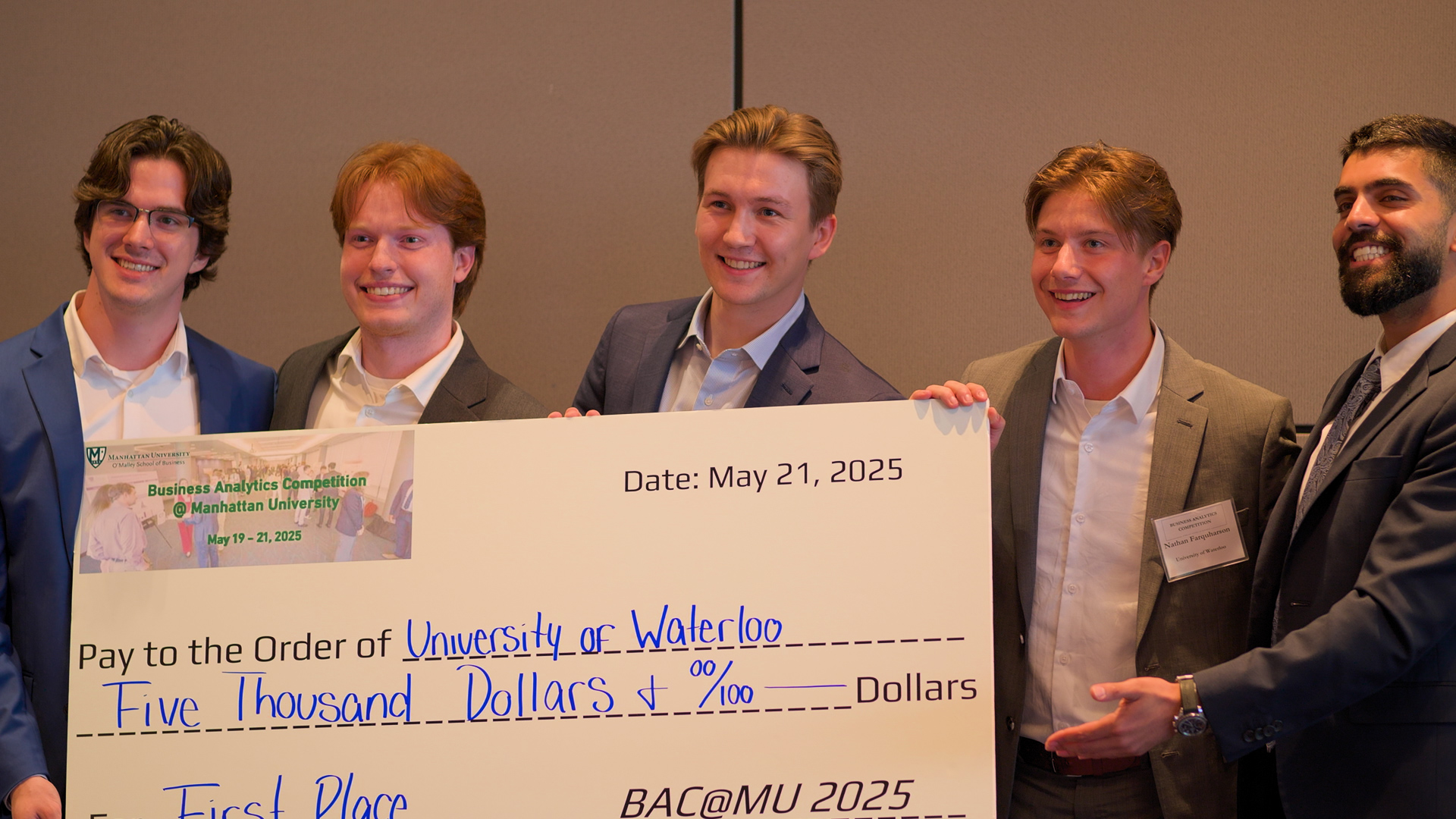 student presents poster during competition