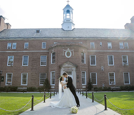 Bride and groom outside on the quad
