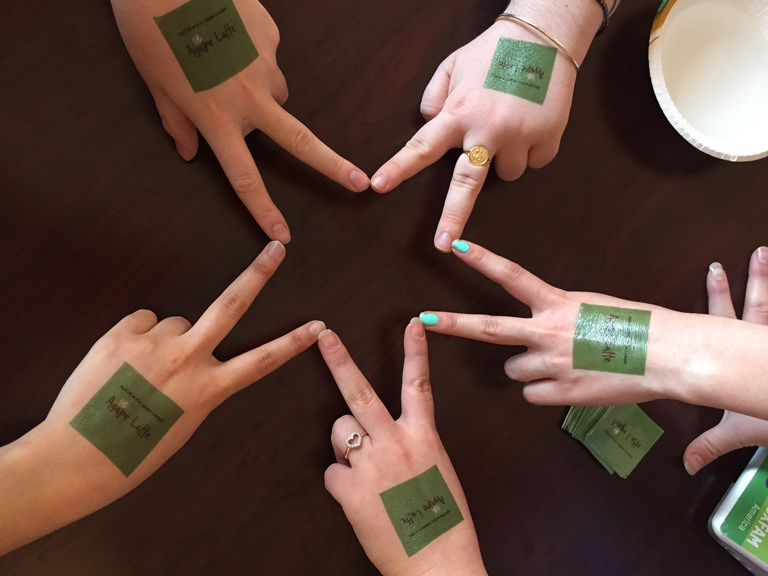 Students make a Lasallian star with their fingers.