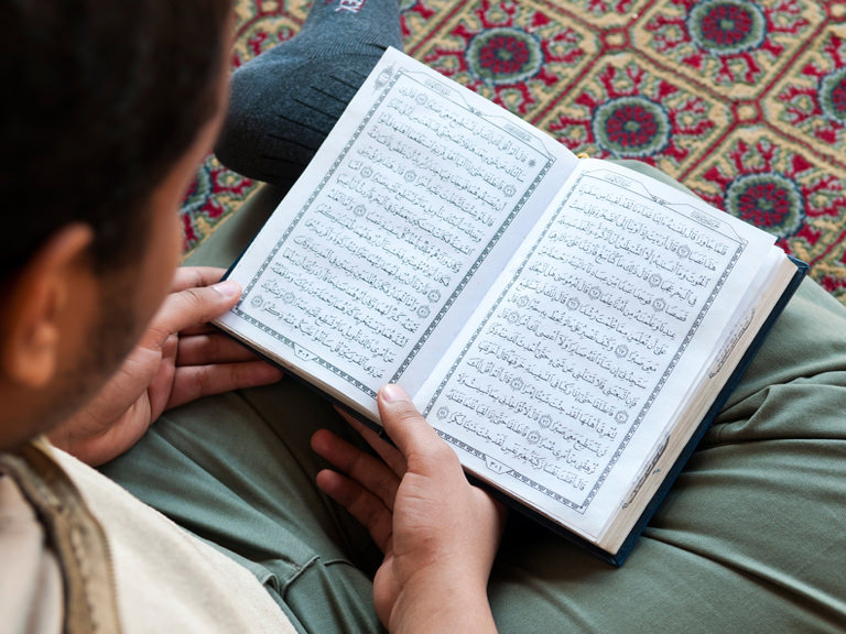 Student reading the Quran.