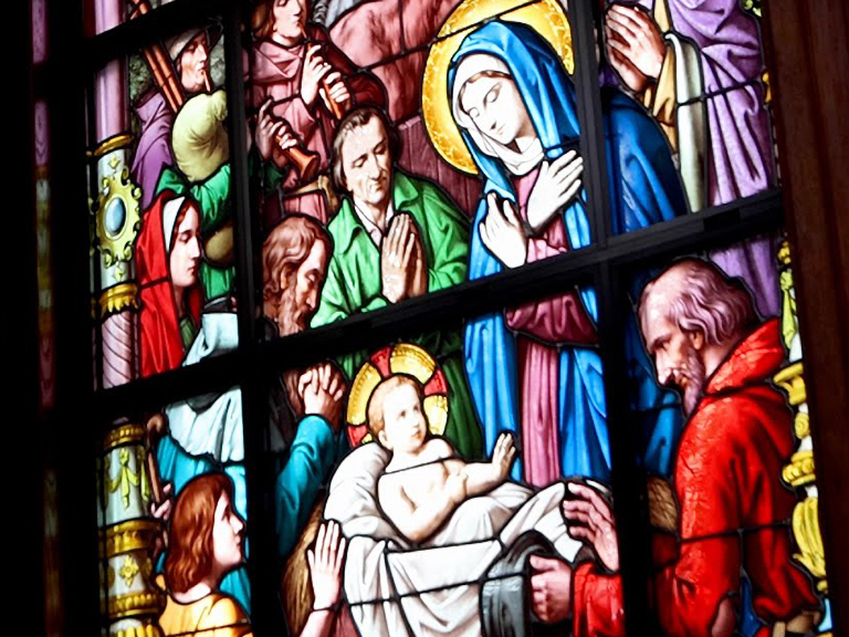 stained glass window showing holy nativity scene on Christmas