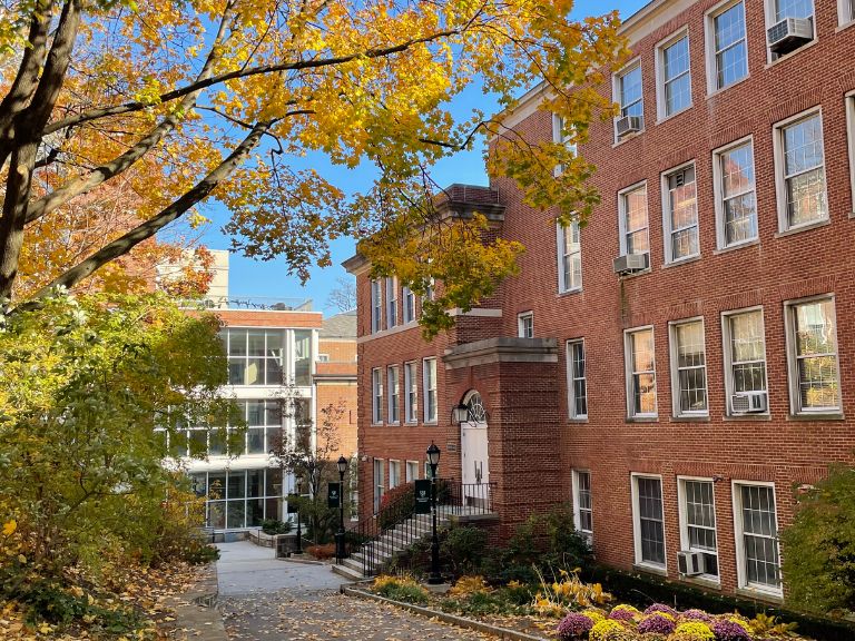 Hayden Hall on the Manhattan College campus in the fall with leaves on the ground