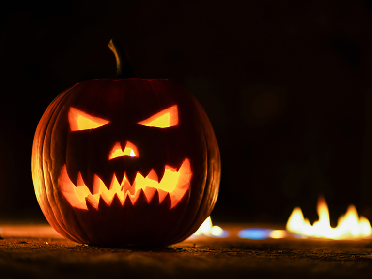 jack o lantern pumpkin lit up in the dark