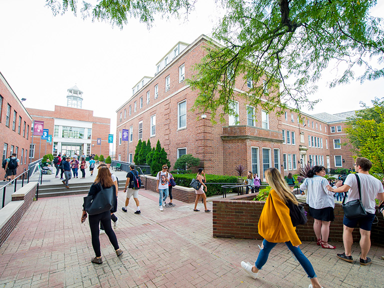 Students walking near O'Malley Library on campus