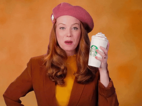 video of woman holding coffee beverage with words PSL IS LIFE showing on screen