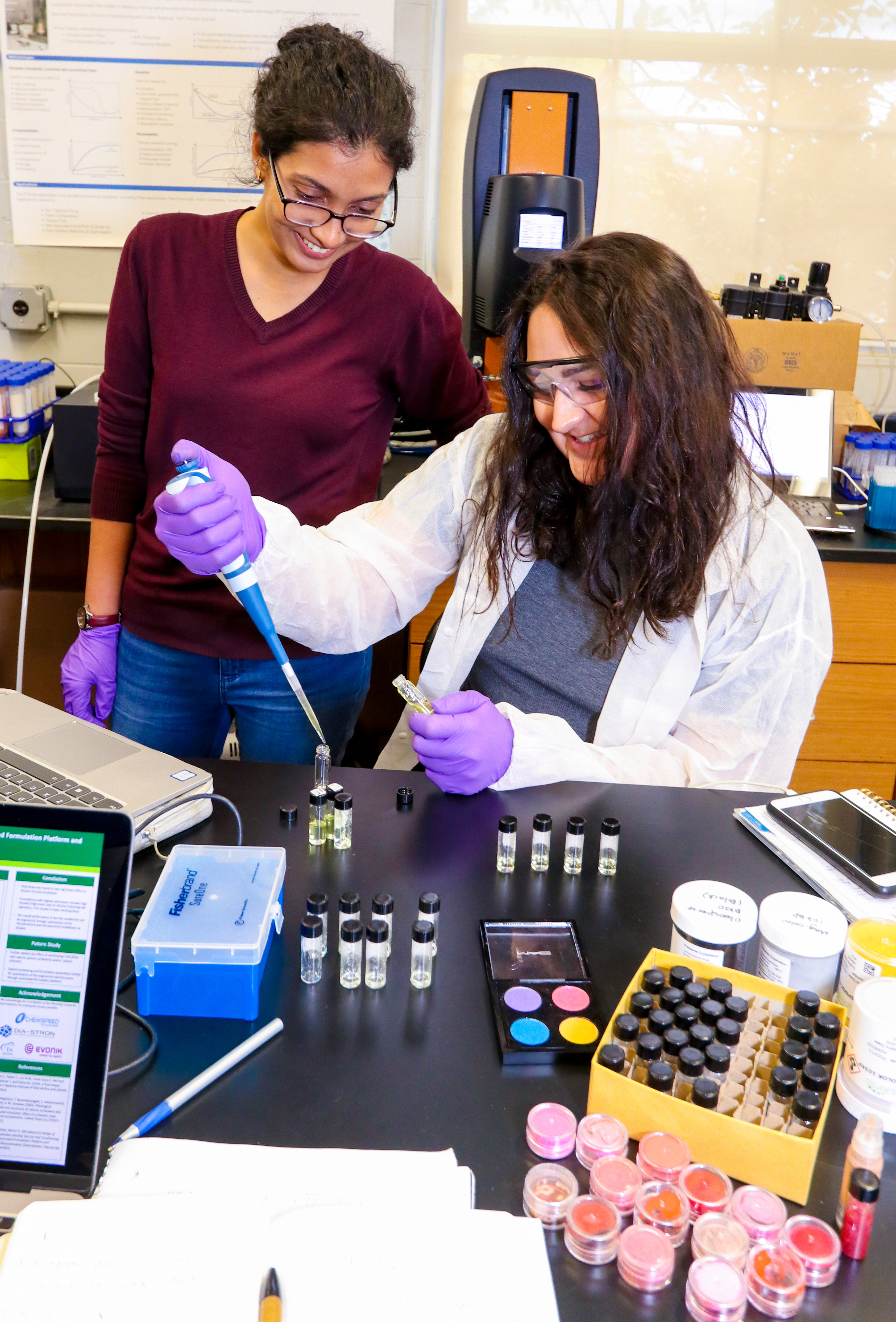 Two female graduate students working in the cosmetic engineering lab at Manhattan College. 