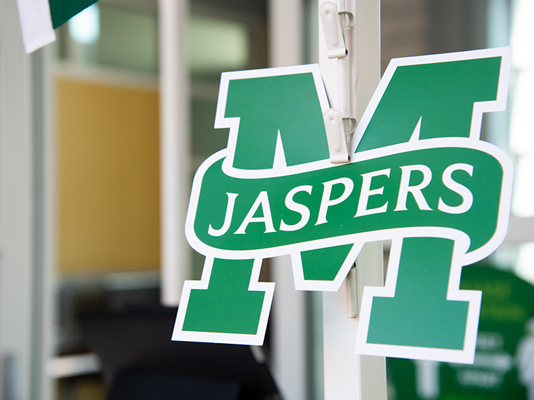 M Jasper logo on O'Malley library entrance