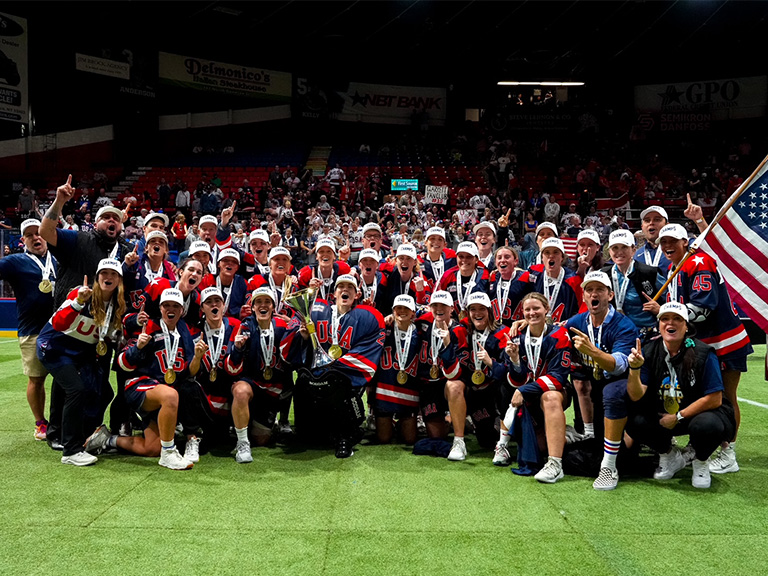 The U.S.A. women's box lacrosse team celebrate their world championship win. Ryan Wheeler '01 is front row, second from right.