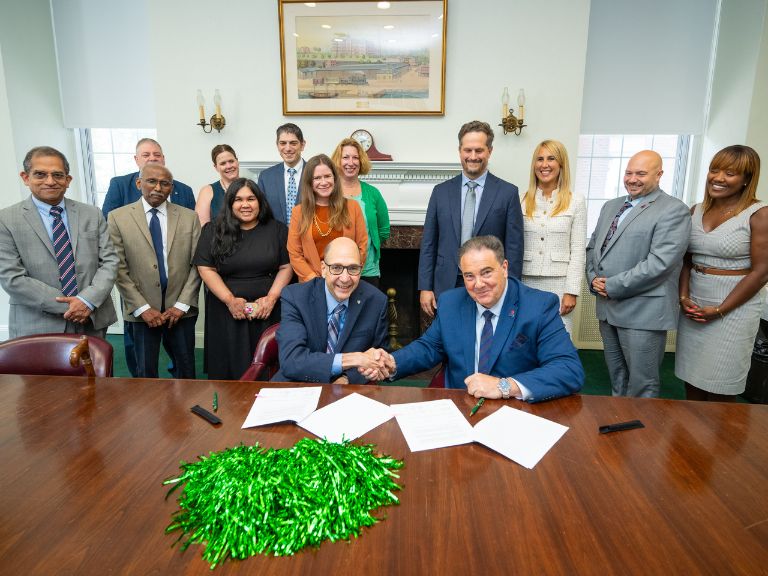 Photo of Manhattan College and St Francis College signing the new articulation agreement