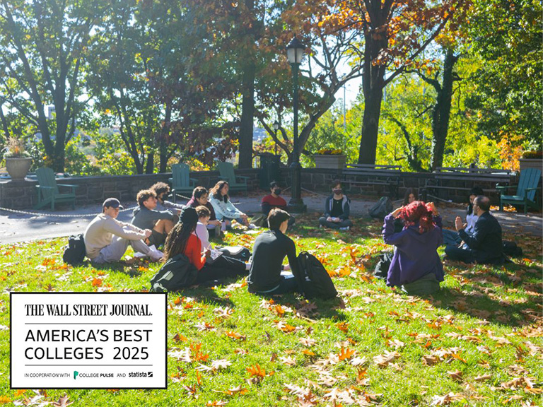 Students sitting on the quad with the Wall Street Journal College Rankings logo