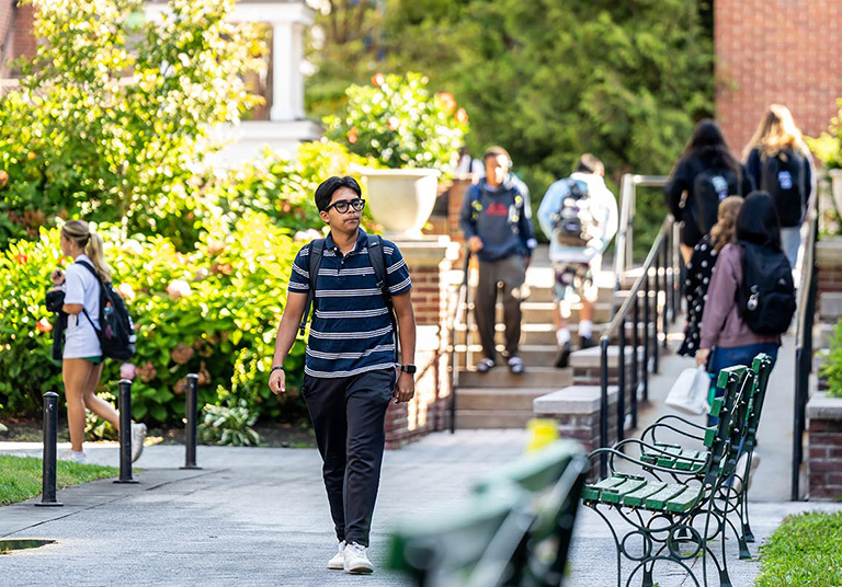 Image of students walking on the campus of Manhattan University